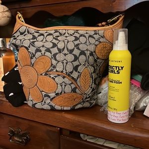 Coach denim tooled floral vachetta wallet. Matching shoulder bag.